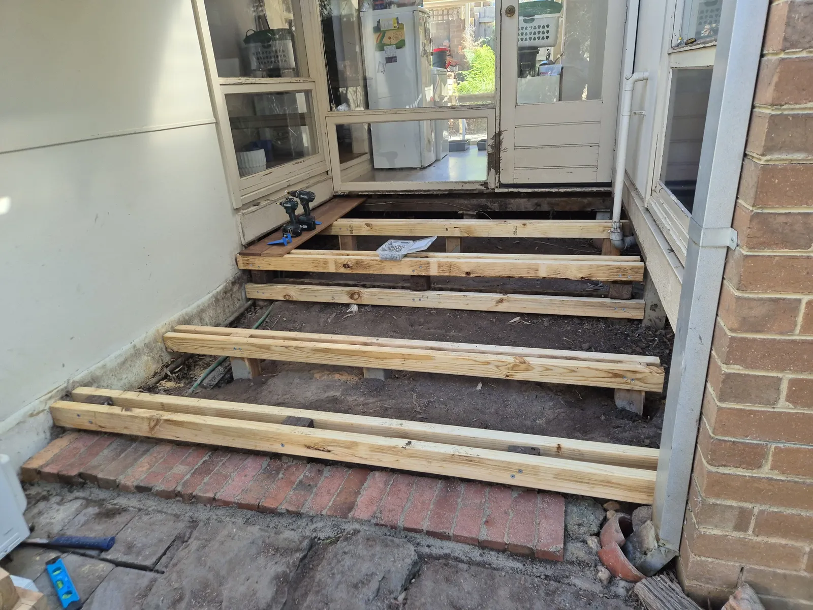 New treated pine joists laid for back-door deck